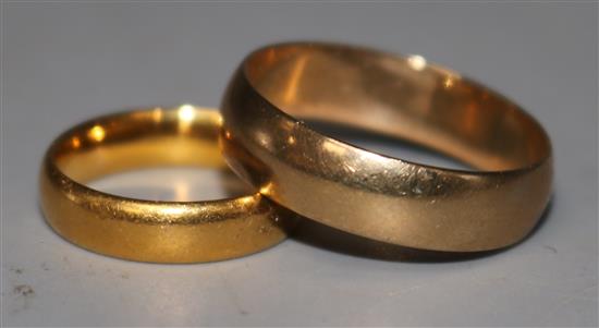 A 22ct gold wedding band and a 9ct gold wedding band.